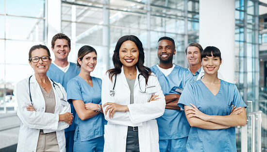 Portrait of a group of medical practitioners standing together in a hospital Portrait of a group of medical practitioners standing together in a hospital