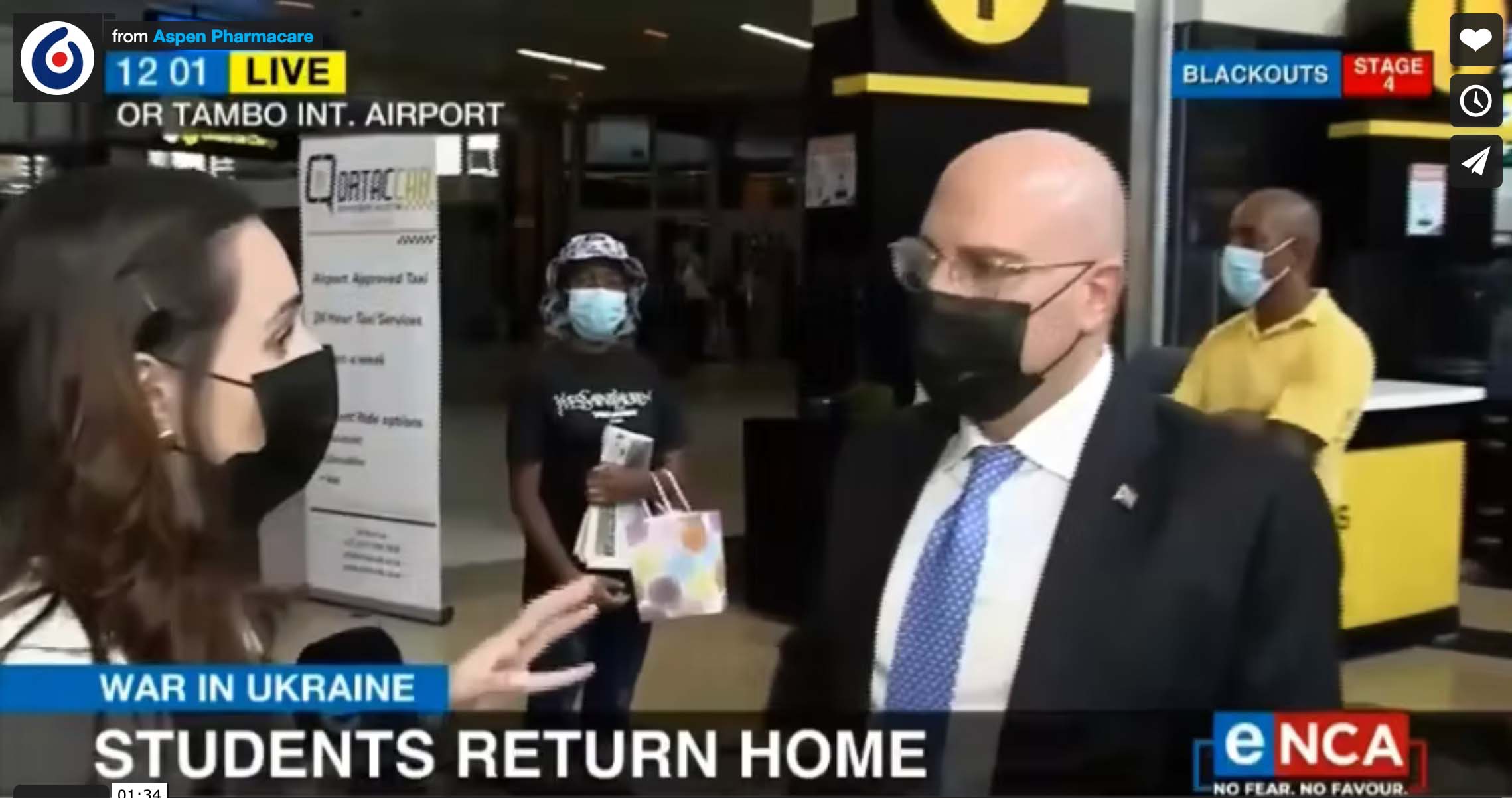 eNCA's Heidi Giokos and Stavros Nicolaou at OR Tambo International Airport marking the arrival of 10 South African students who were fleeing the war-stricken Ukraine